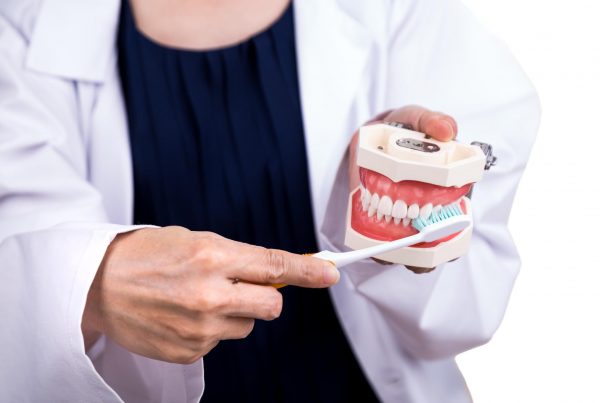 Series of dentist showing correct method of brushing teeth